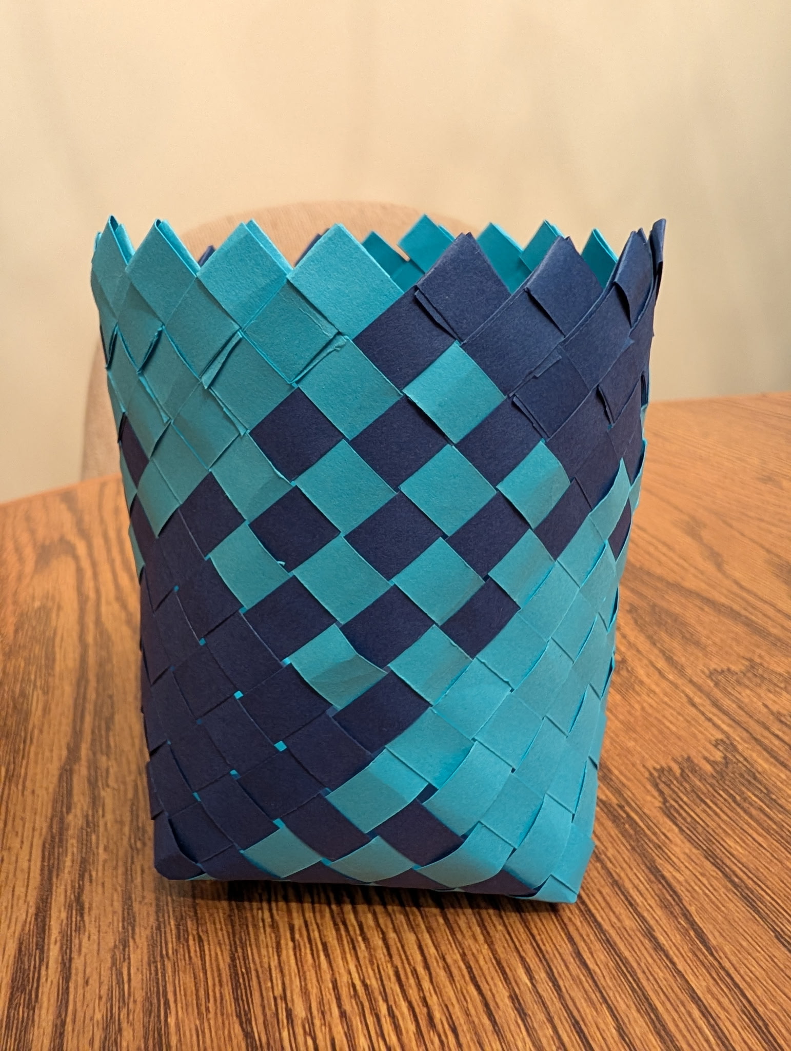 Plaited handwoven basket using paper strips